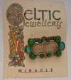 Vintage Miracle Buckle brooch green stones 