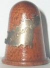 WOODEN THIMBLE WITH A METAL MAP OF JERSEY 