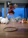 1 mickey the sorcerer christmas ornament sitting on a glass bell 